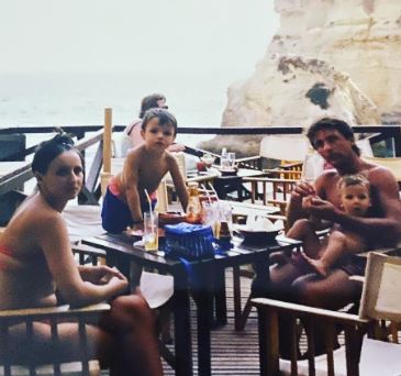 Early picture of Joao Dias and his wife with their young sons